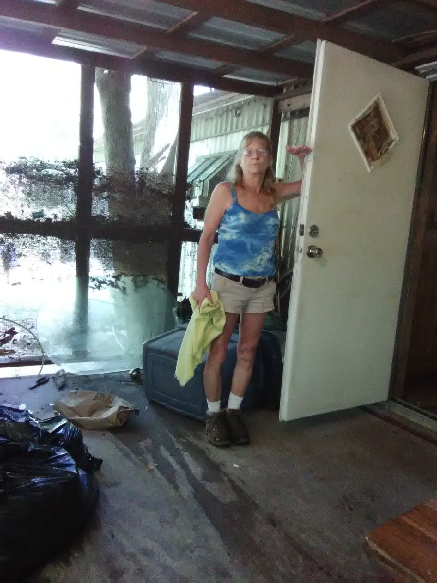 Woman in flood damaged home